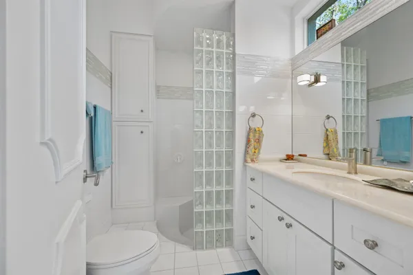 a picture of a bathroom with a shower