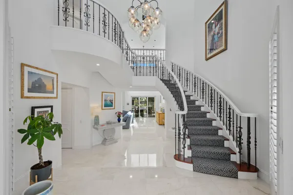 a kitchen with a sink stove and wooden floor