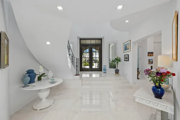 a kitchen with stainless steel appliances granite countertop a stove and a wooden floors