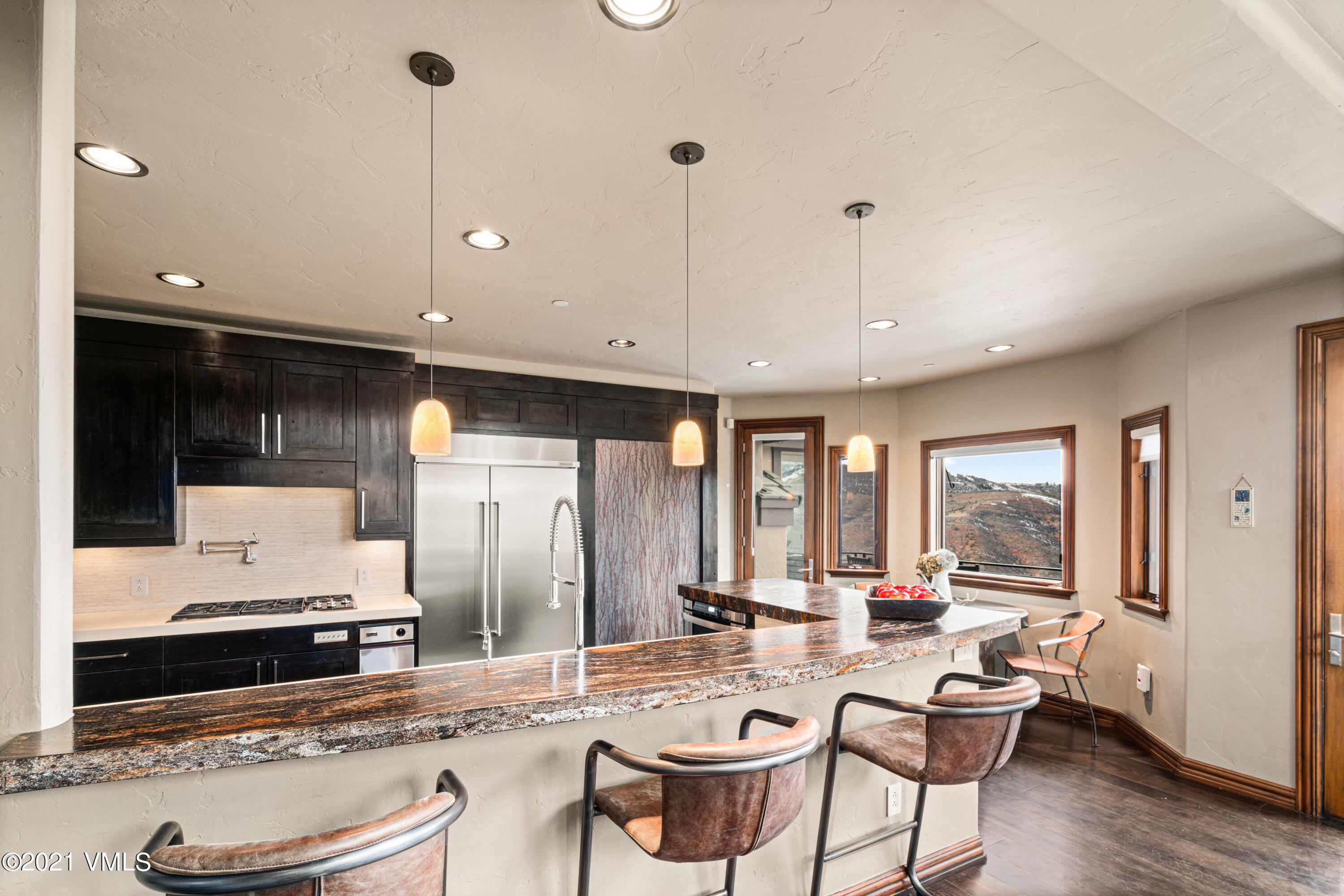 240 Casteel Ridge Edwards, CO 81632 - Photo 21 of 83 a living room with furniture and a large window