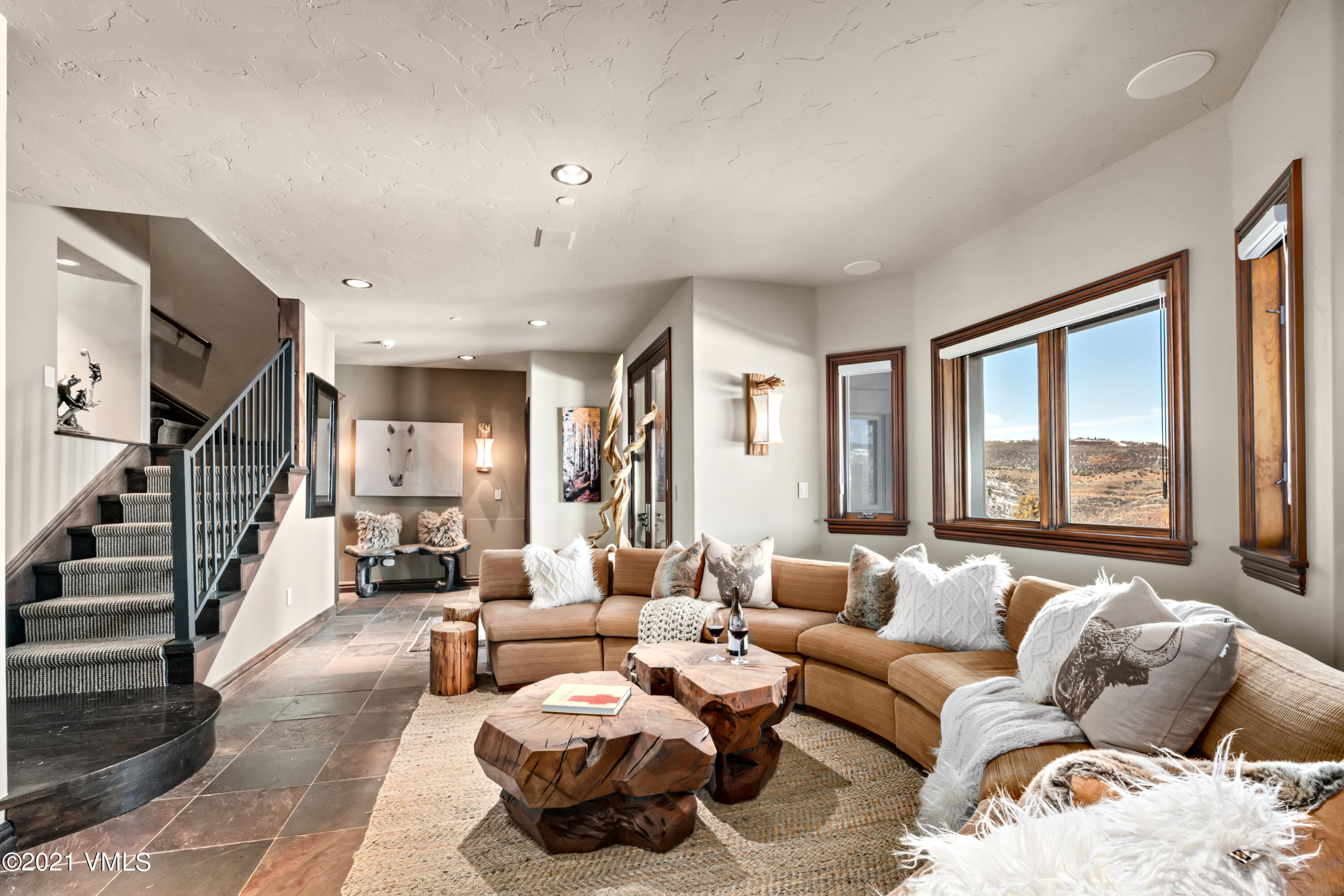 240 Casteel Ridge Edwards, CO 81632 - Photo 28 of 83 a living room with furniture and large windows