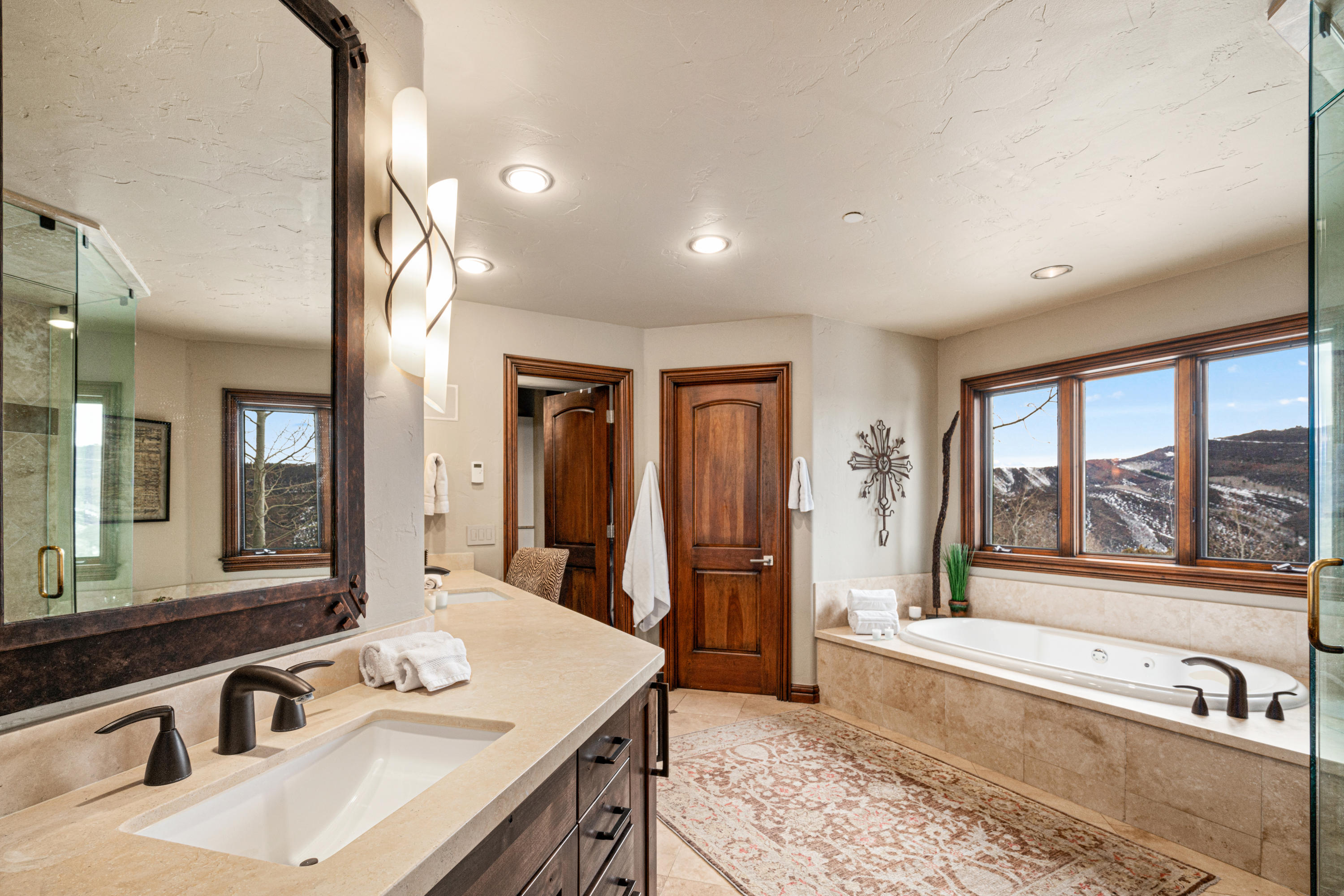 240 Casteel Ridge Edwards, CO 81632 - Photo 35 of 83 a spacious bathroom with a tub a sink and a mirror