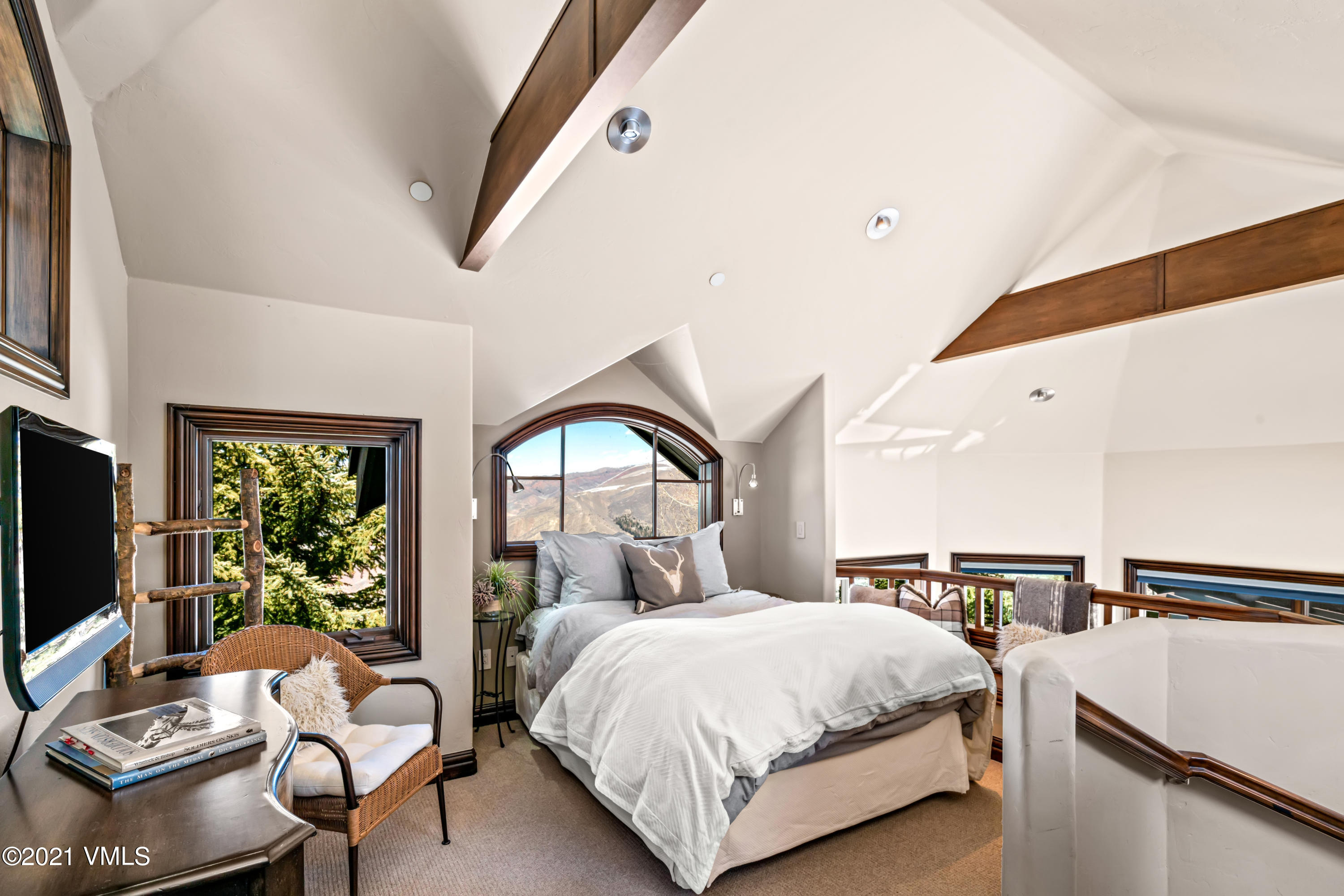 240 Casteel Ridge Edwards, CO 81632 - Photo 42 of 83 a bedroom with a bed and large windows