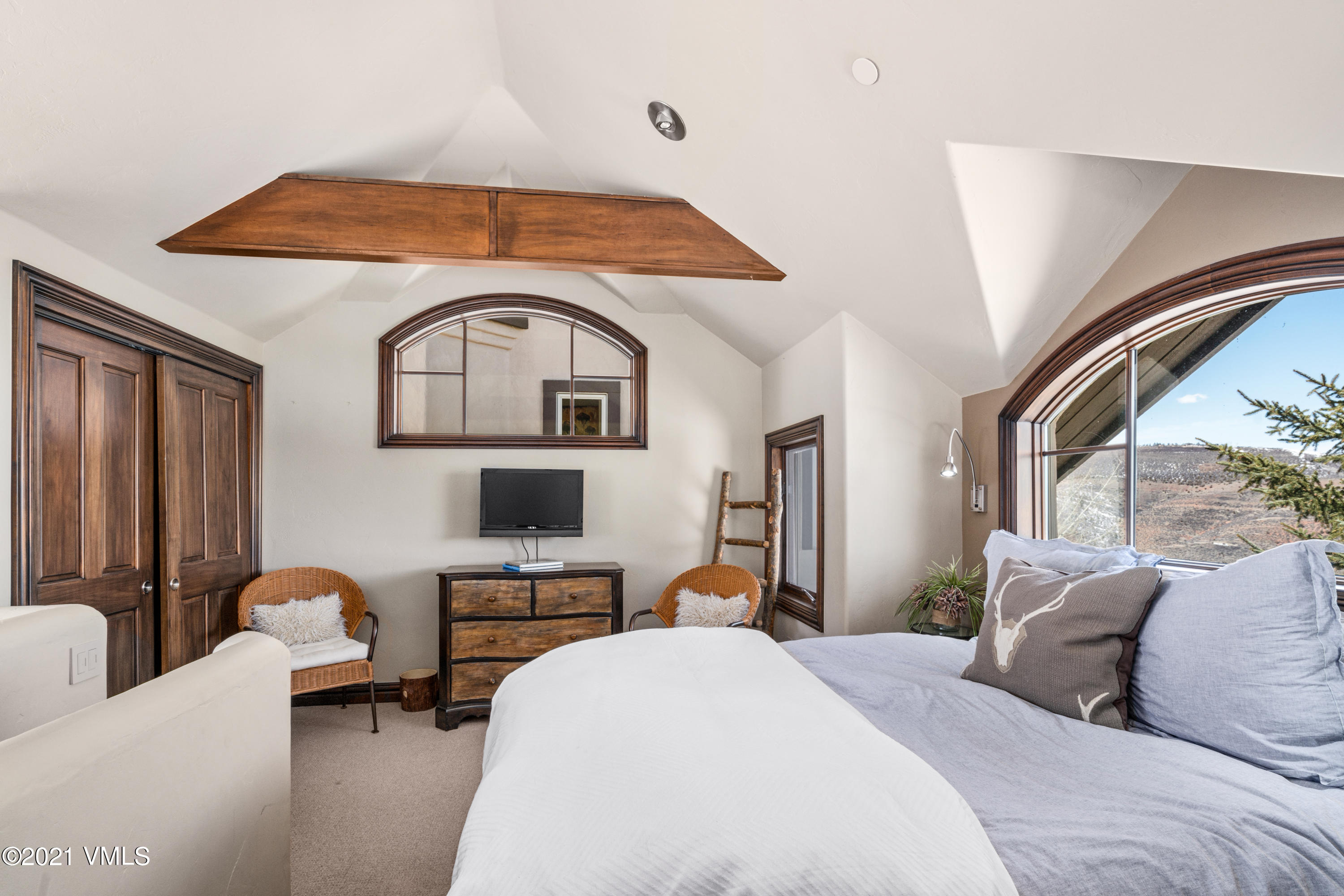 240 Casteel Ridge Edwards, CO 81632 - Photo 43 of 83 a bedroom with a bed couch and window