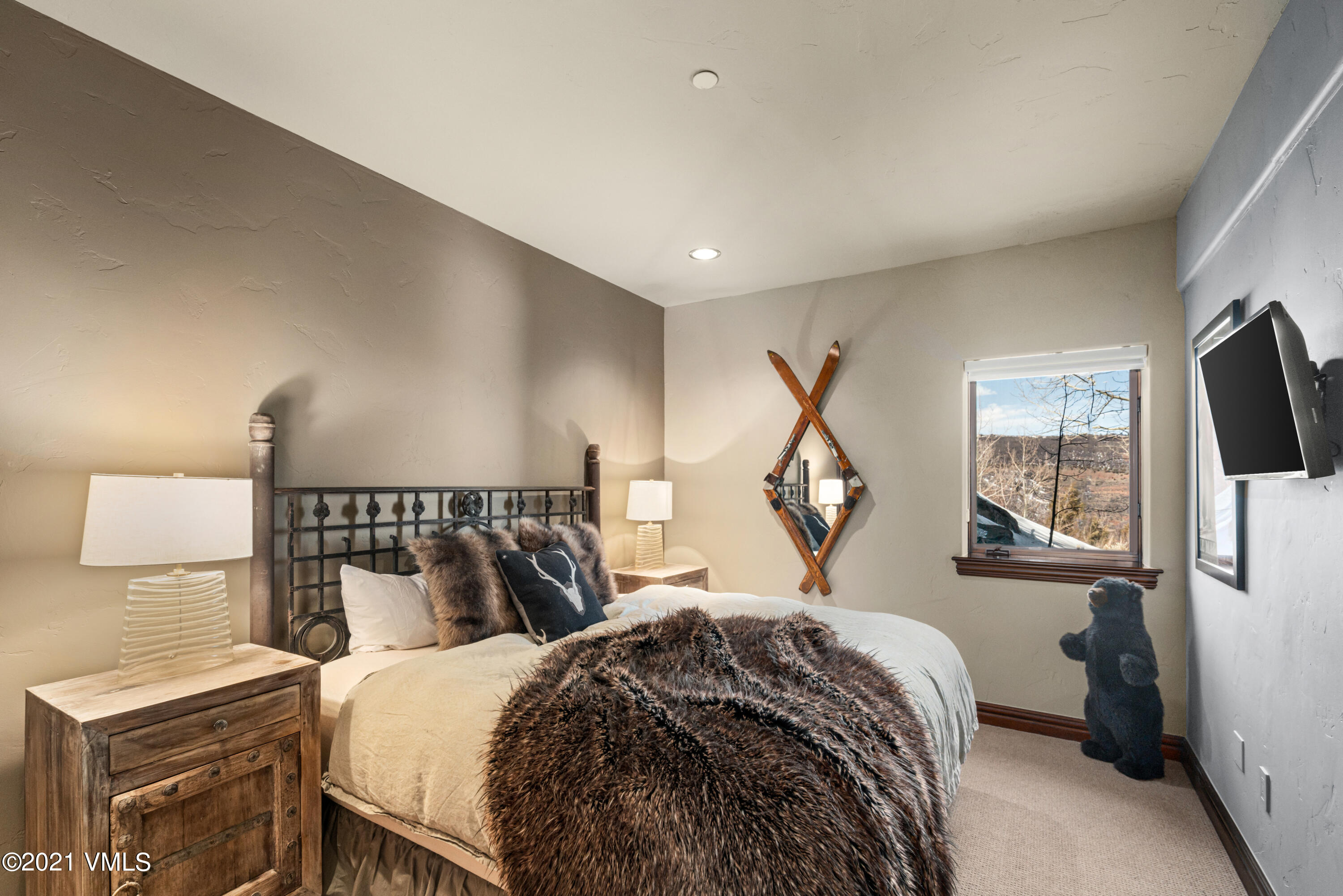 240 Casteel Ridge Edwards, CO 81632 - Photo 47 of 83 a bedroom with a bed and wooden floor