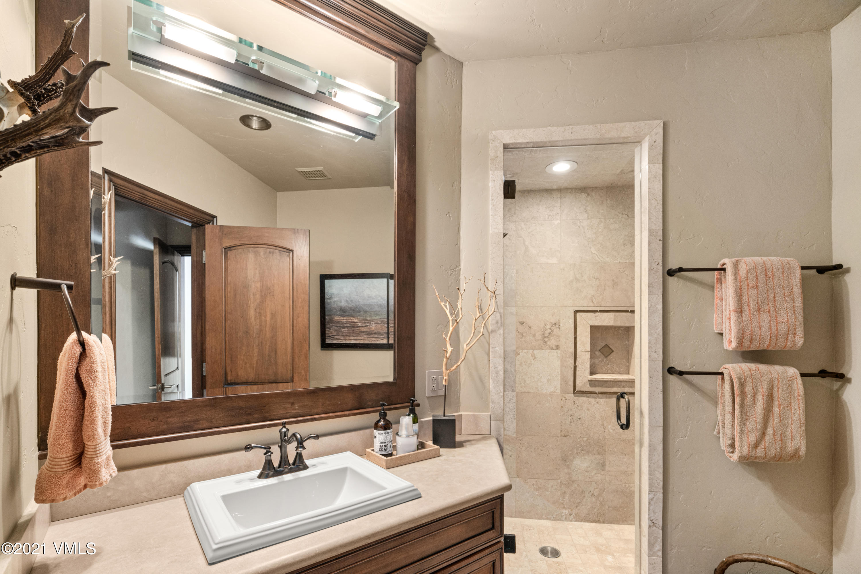 240 Casteel Ridge Edwards, CO 81632 - Photo 48 of 83 a bathroom with a sink vanity granite and a mirror