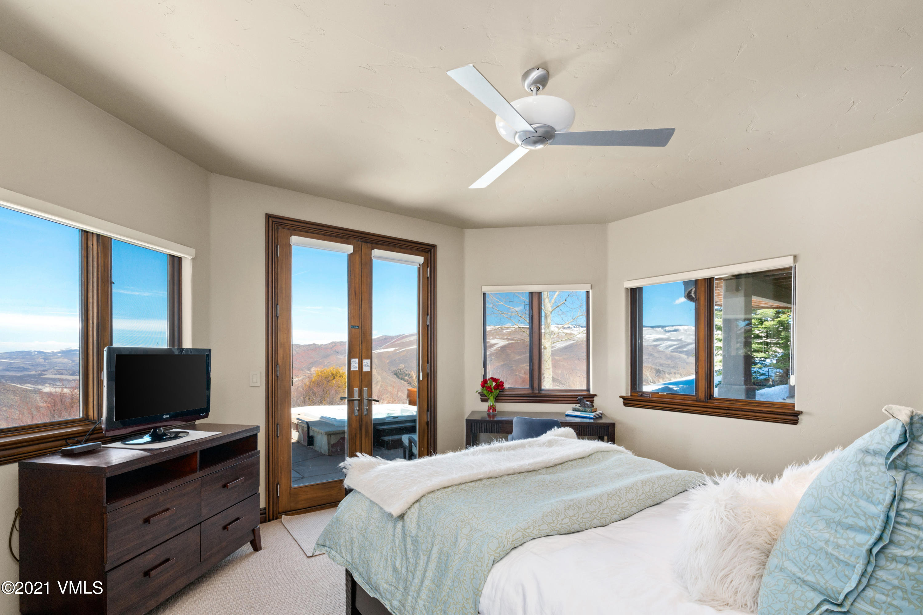 240 Casteel Ridge Edwards, CO 81632 - Photo 50 of 83 a bedroom with a bed and a flat screen tv