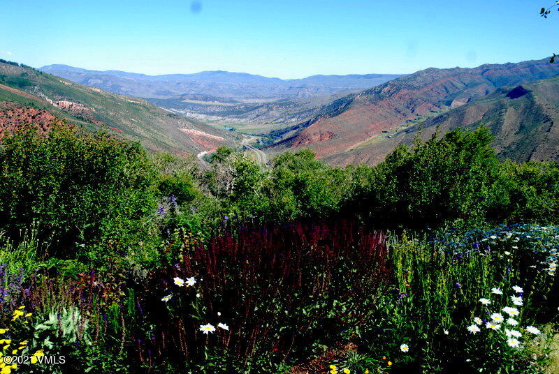 240 Casteel Ridge Edwards, CO 81632 - Photo 72 of 83 a view of a lush green hillside and mountains