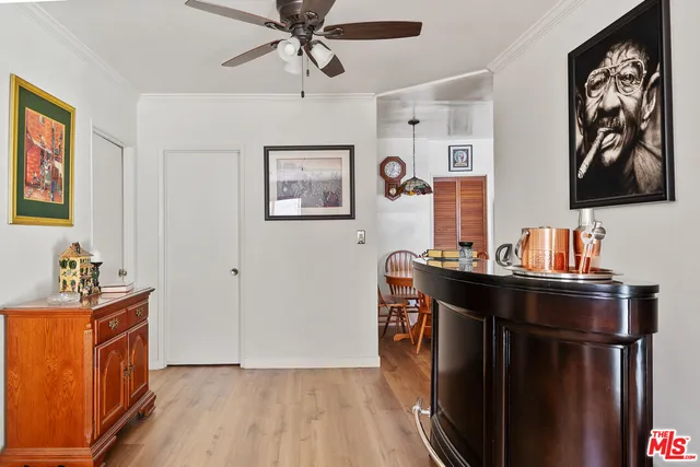 a room with a window and a mirror