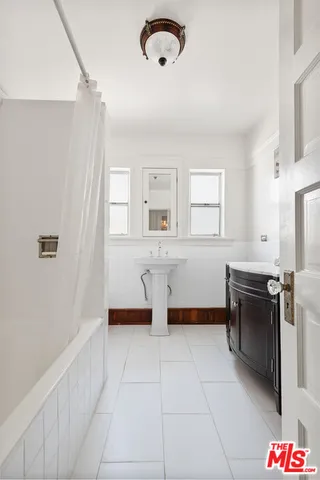 a kitchen with a refrigerator and microwave