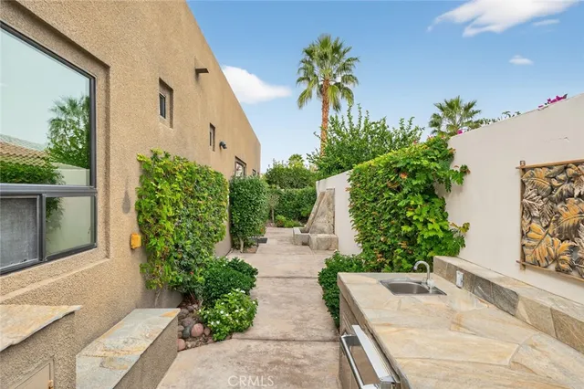 a kitchen with granite countertop a stove and a microwave
