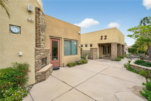 a view of an empty room with a fireplace and a window