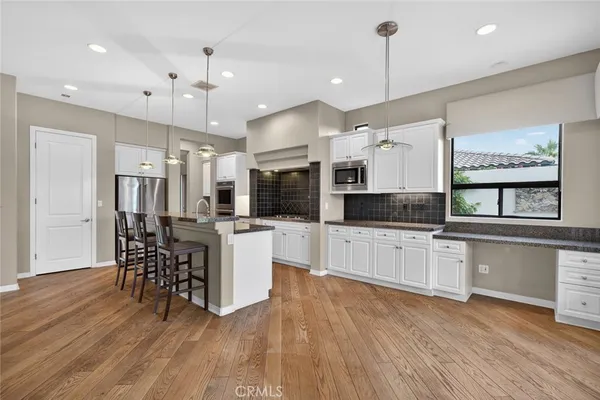 a bathroom with a sink a vanity and a mirror