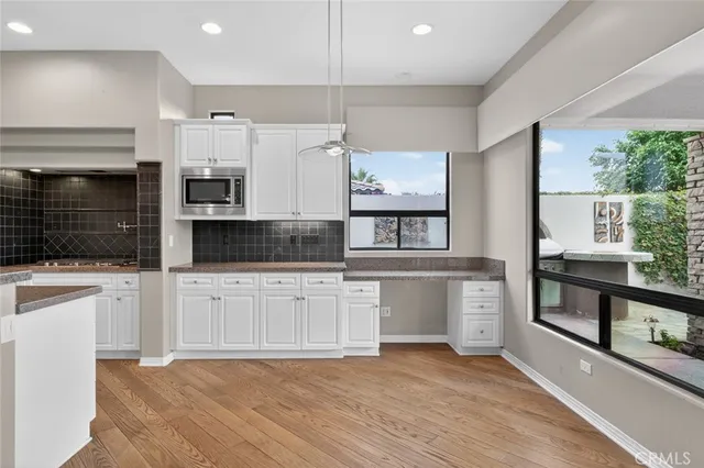 a bathroom with a sink a vanity and a mirror