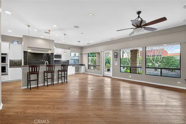 an empty room with closet and entryway
