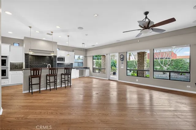 a bathroom with a double vanity sink toilet and a mirror