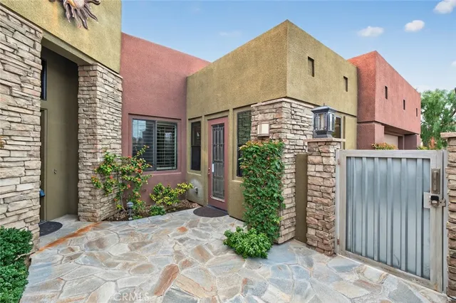 a view of a house with a yard patio and swimming pool