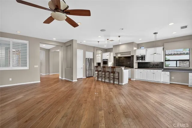 an empty room with closet and entryway