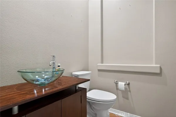 a view of a room with window wooden floor and chandelier