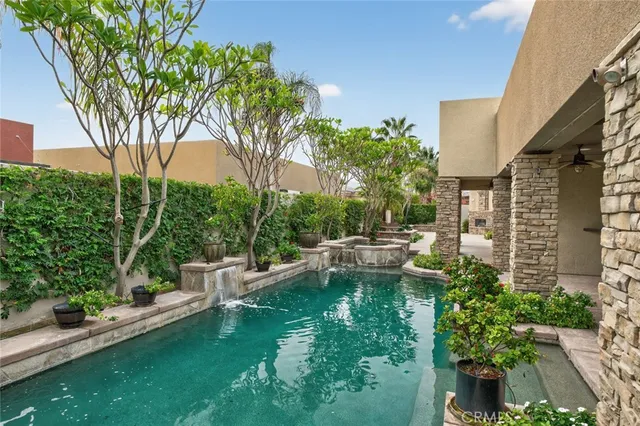 a view of a patio with table and chairs and potted plants