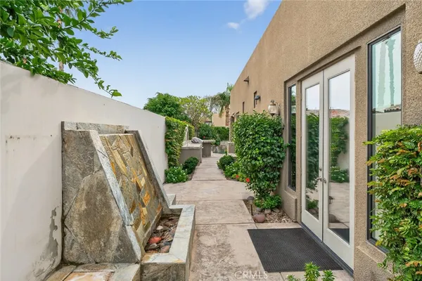 a kitchen with stainless steel appliances granite countertop a sink a oven and a large window