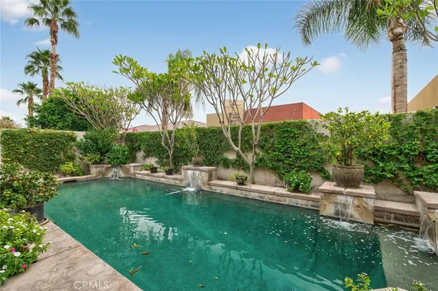 a kitchen with stainless steel appliances granite countertop a sink a oven and a large window