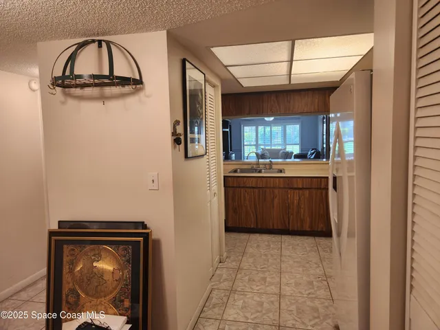 a kitchen with stainless steel appliances a refrigerator and a stove top oven