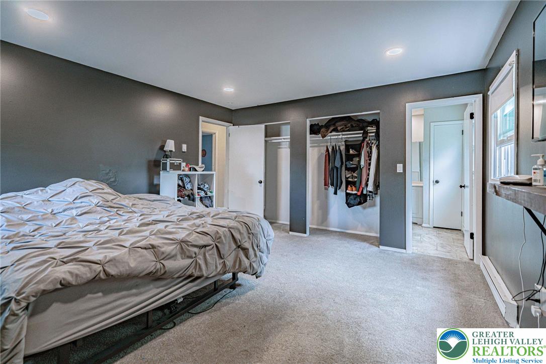7523 Franks Drive Bath, PA 18014 - Photo 23 of 40 a spacious bedroom with a bed and a walk in closet