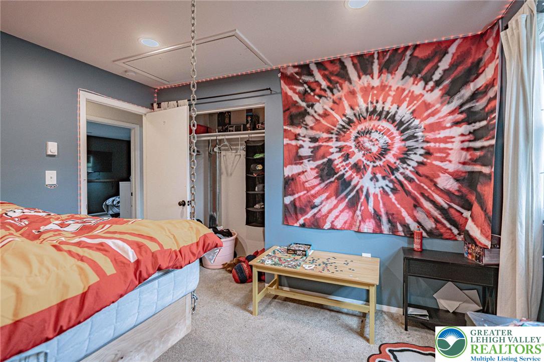 7523 Franks Drive Bath, PA 18014 - Photo 27 of 40 a bedroom with a bed and a painting on the wall