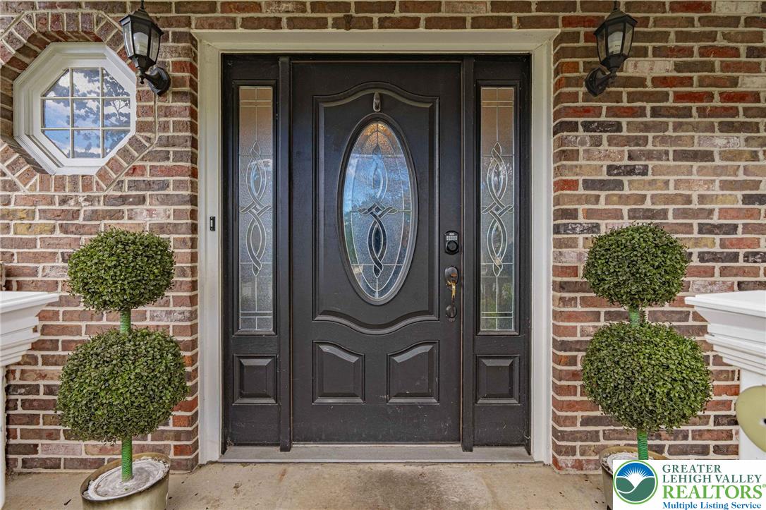 7523 Franks Drive Bath, PA 18014 - Photo 3 of 40 a front view of a house with garden