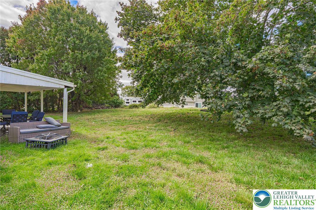 7523 Franks Drive Bath, PA 18014 - Photo 33 of 40 a view of a house with a backyard porch and sitting area