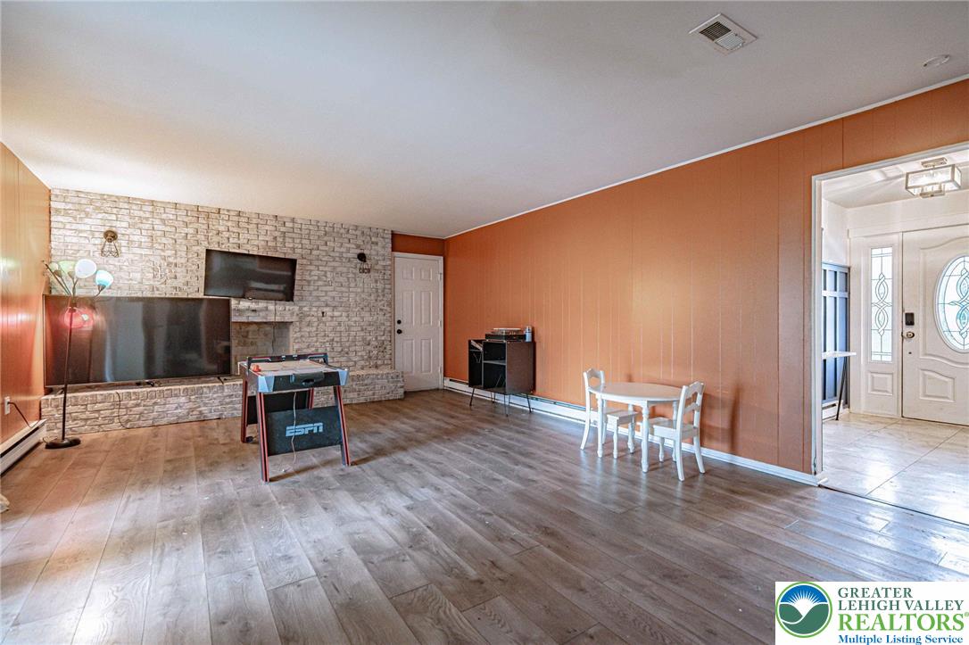 7523 Franks Drive Bath, PA 18014 - Photo 9 of 40 a view of a livingroom with furniture and a flat screen tv