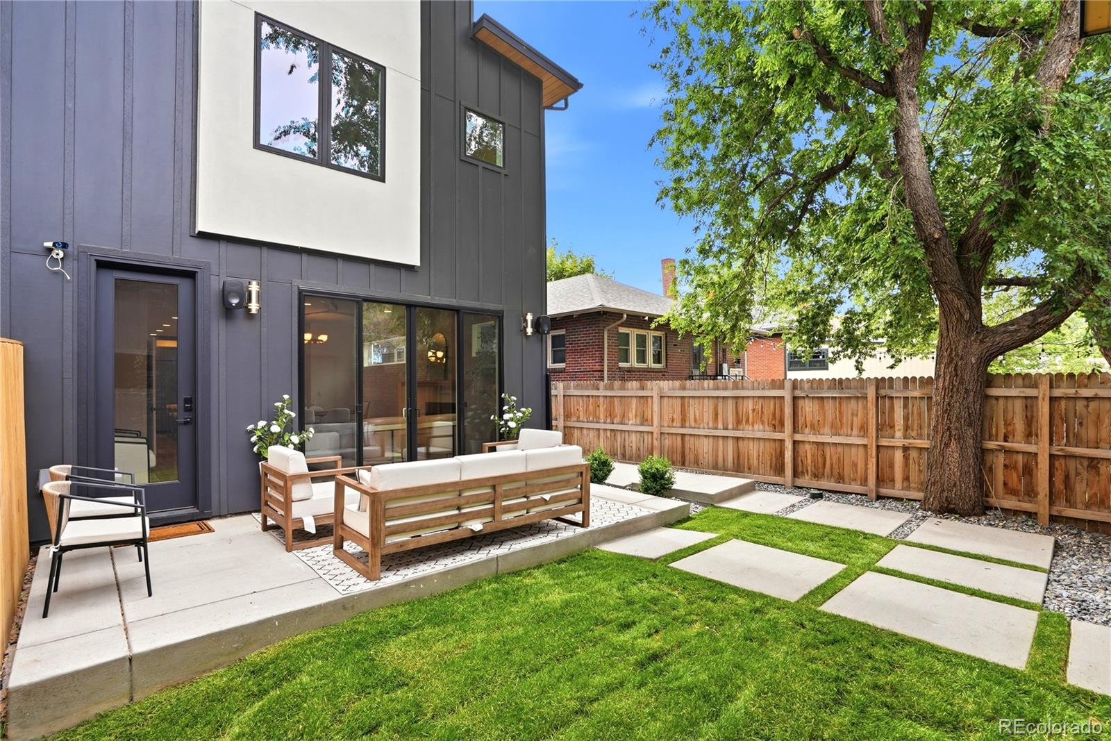 245 South Emerson Street Denver, CO 80209 - Photo 6 of 49 a view of a house with backyard and sitting area
