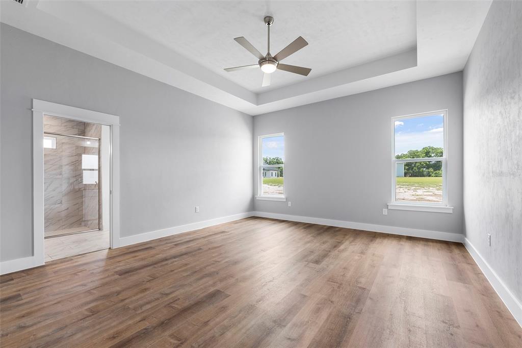 0 Southwest Meadow View Lake City, FL 32024 - Photo 11 of 31 a view of an empty room with wooden floor and a window