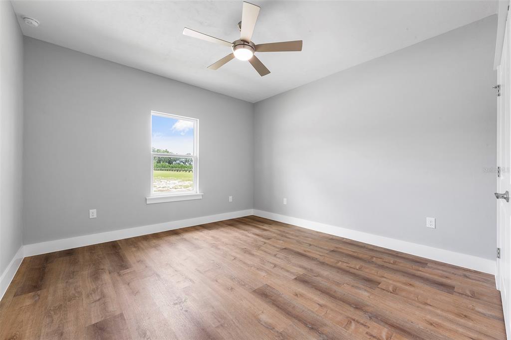 0 Southwest Meadow View Lake City, FL 32024 - Photo 18 of 31 wooden floor in an empty room with a window