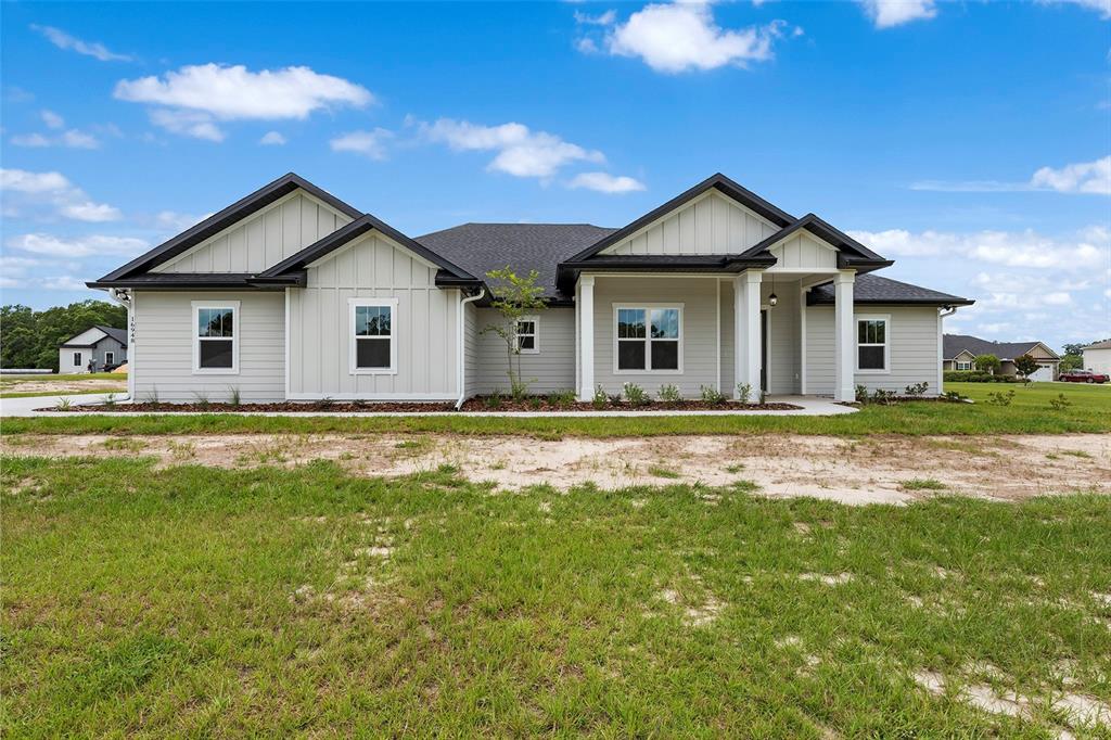 0 Southwest Meadow View Lake City, FL 32024 - Photo 25 of 31 a view of a house with a yard and potted plants