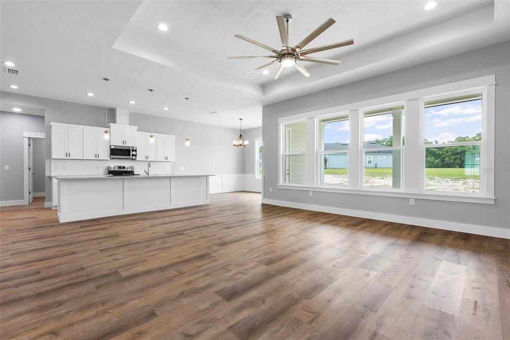 0 Southwest Meadow View Lake City, FL 32024 - Photo 3 of 31 an empty room with wooden floor and windows