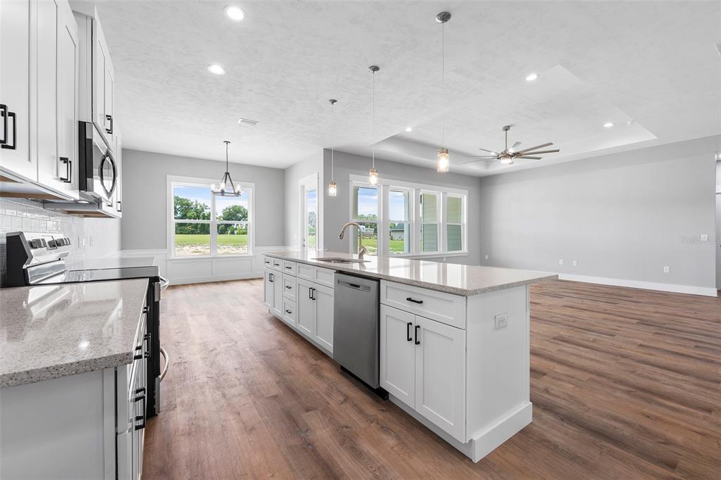 0 Southwest Meadow View Lake City, FL 32024 - Photo 6 of 31 a large kitchen with stainless steel appliances lots of counter space and wooden floor