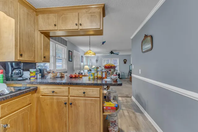 a kitchen with a refrigerator and a sink