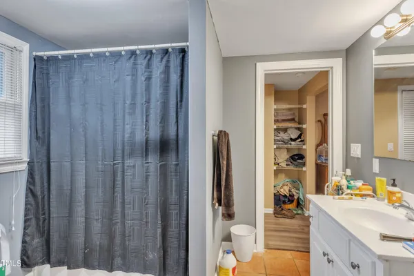 a kitchen with a refrigerator and a sink
