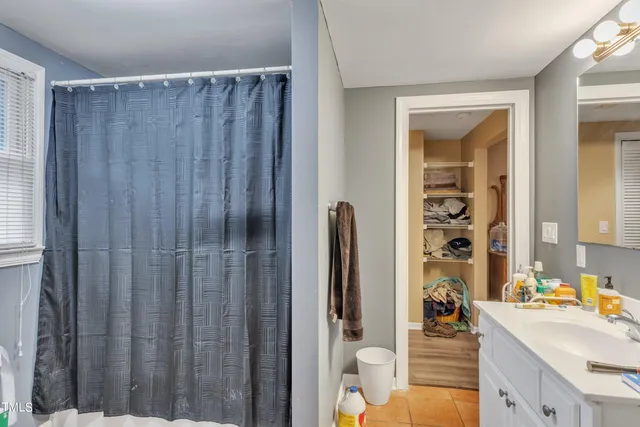 a kitchen with a refrigerator and a sink