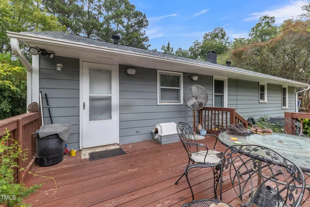 a view of balcony with deck wooden floor and outdoor seating