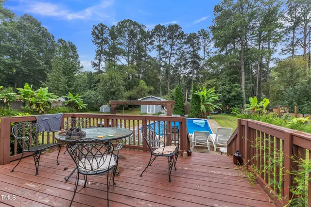 a view of a wooden deck with furniture