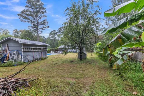 a view of backyard with green space
