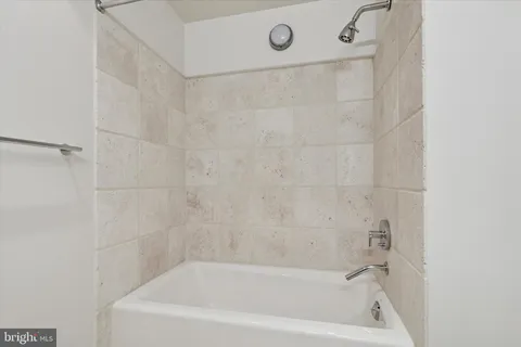 a close up of a bathtub curtain