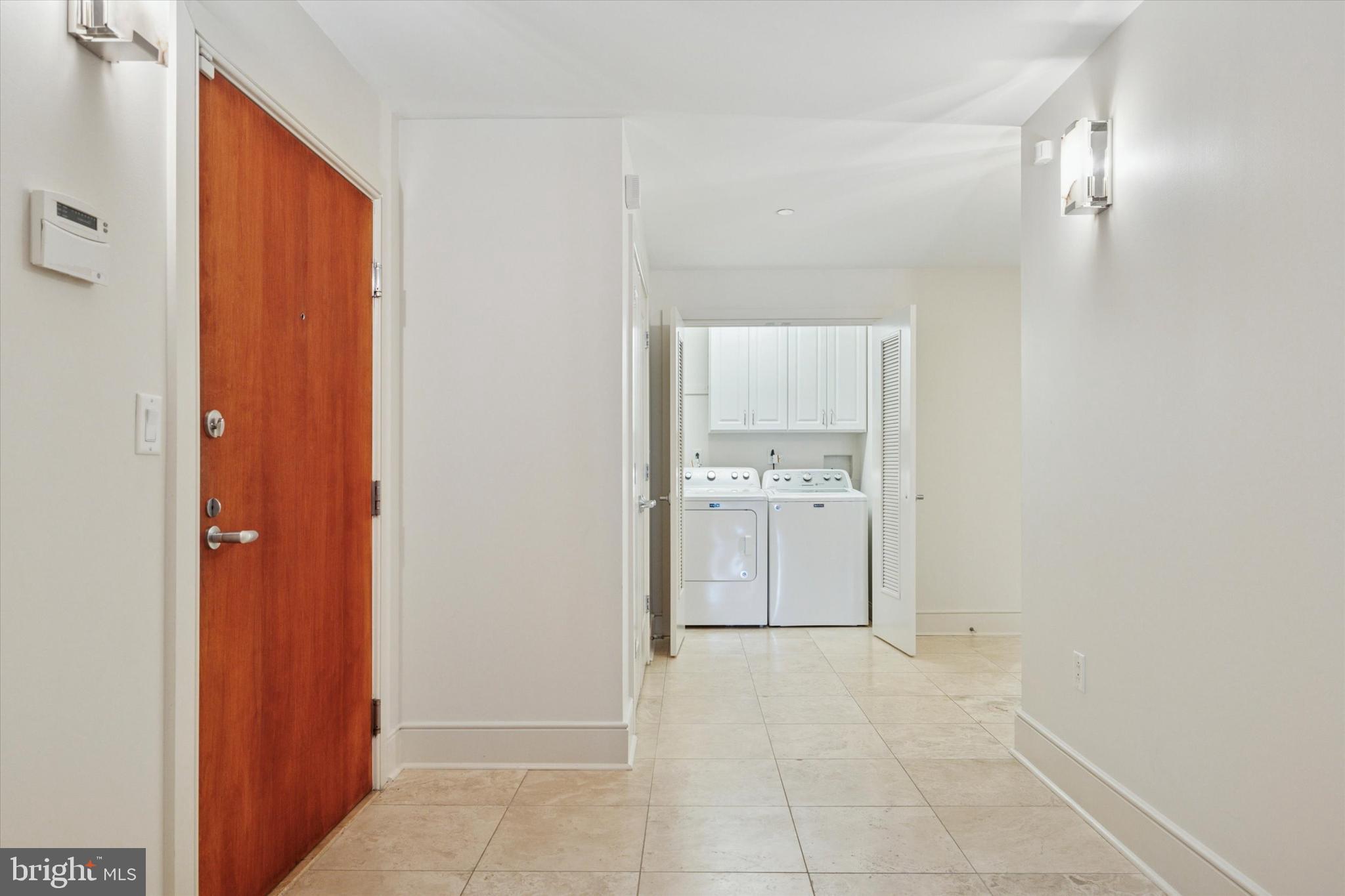 1515 Locust Street, Unit 400 Philadelphia, PA 19102 - Photo 21 of 25 a view of a kitchen with a refrigerator and a sink