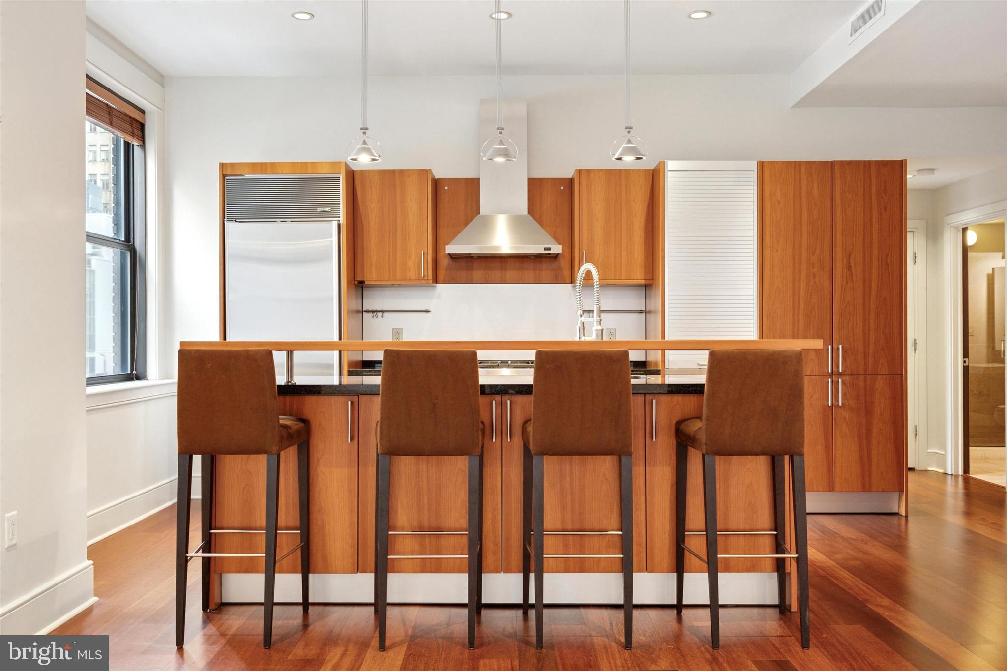 1515 Locust Street, Unit 400 Philadelphia, PA 19102 - Photo 7 of 25 a dining room with furniture and wooden floor
