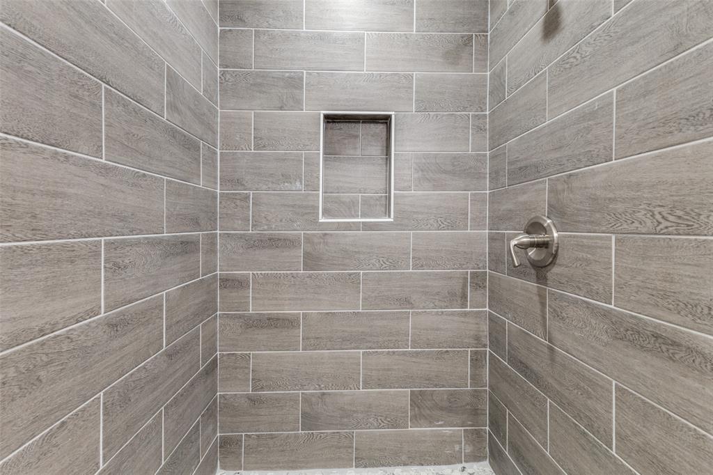 2908 Scottsbluff Drive Dallas, TX 75228 - Photo 18 of 34 a bathroom with a shower