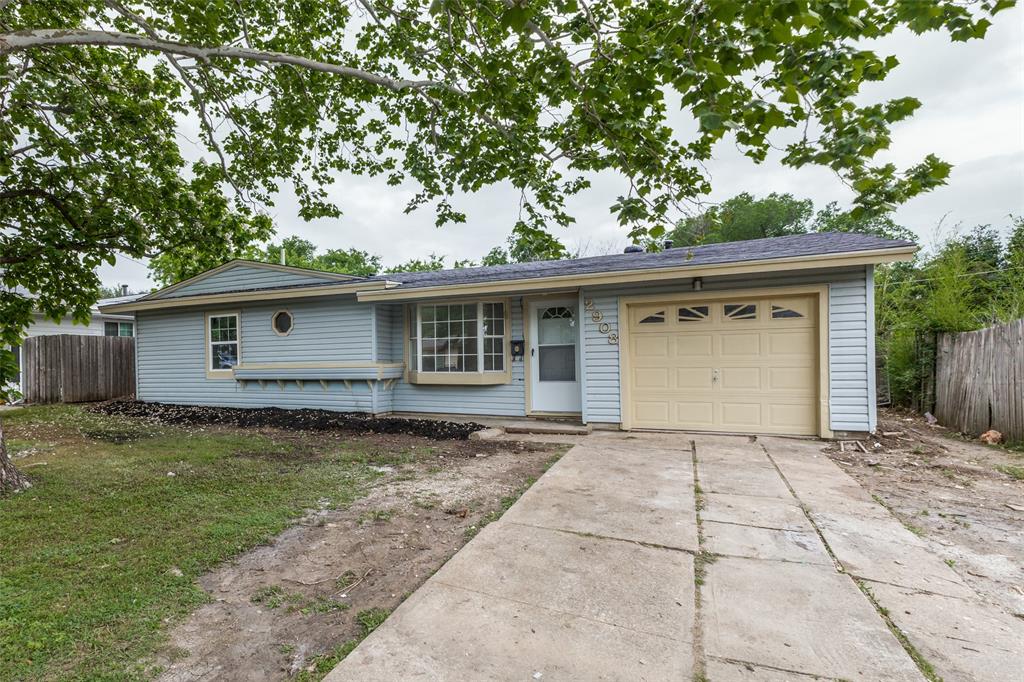 2908 Scottsbluff Drive Dallas, TX 75228 - Photo 24 of 34 a front view of a house with garden