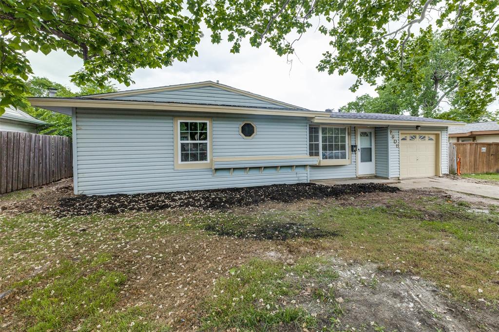 2908 Scottsbluff Drive Dallas, TX 75228 - Photo 25 of 34 a front view of a house with garden